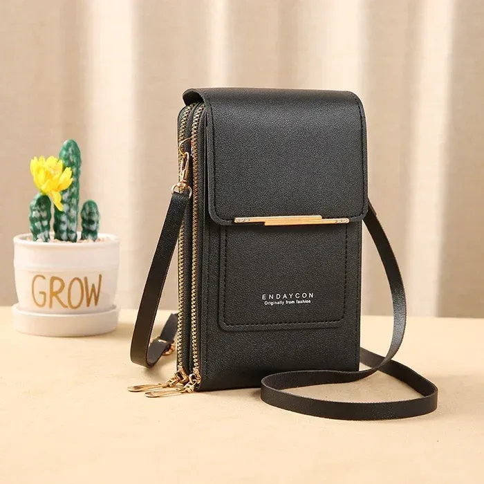 Curated home and lifestyle accessories: leather bag, lint roller, flashlight, and more arranged on a modern surface